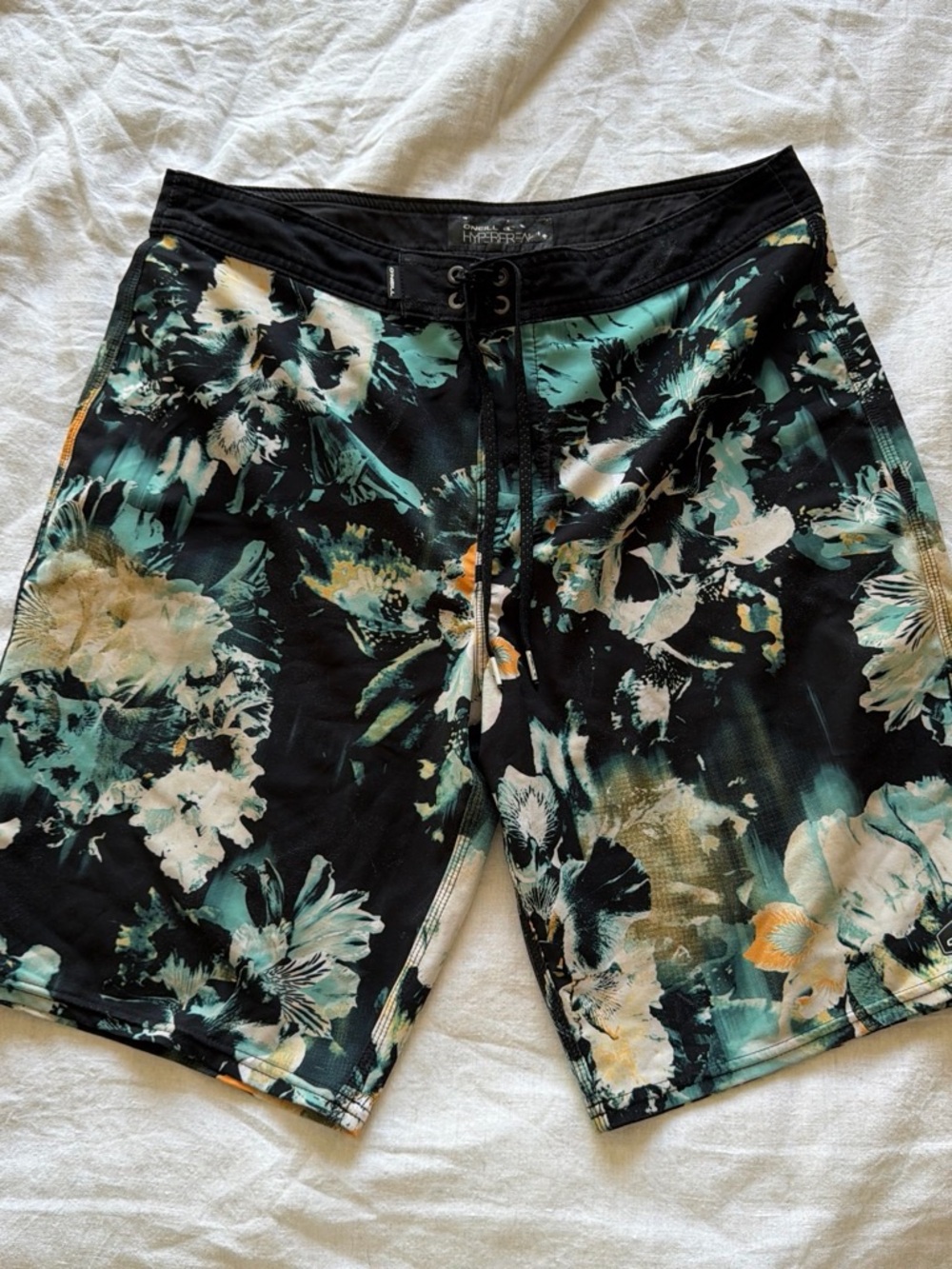 O'Neill Black Floral Swim Board Shorts with Teal & Cream Accents